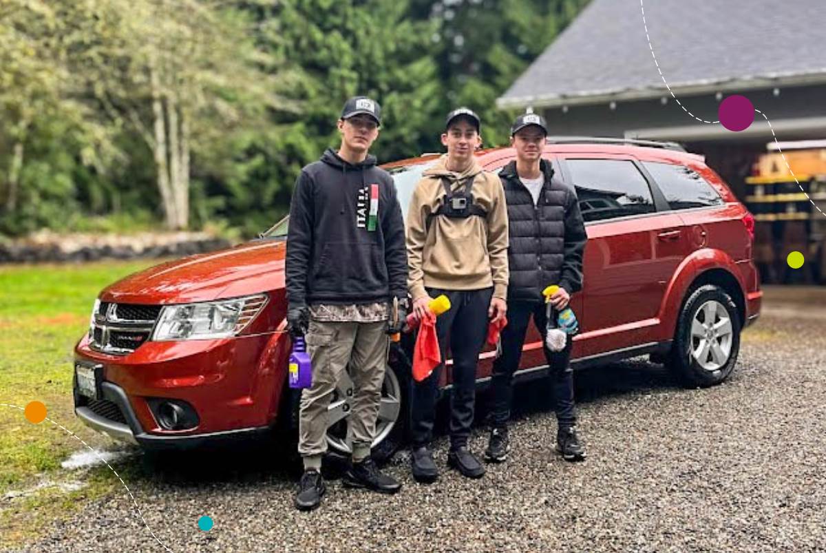 BHB owners pose in front of detailed KCU business vehicle