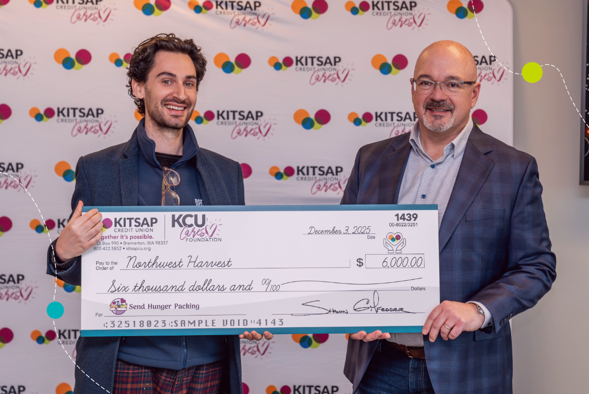 Northwest Harvest representative and Shawn Gilfedder with check