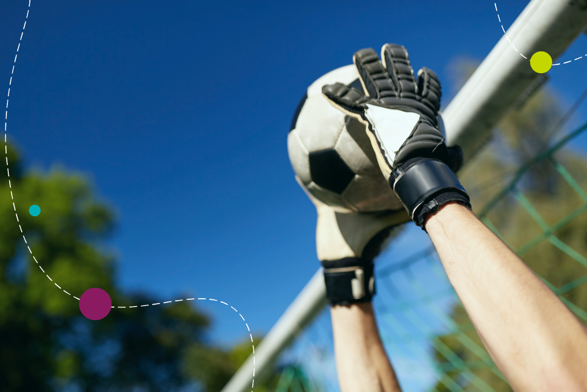 Goalie catching soccer ball