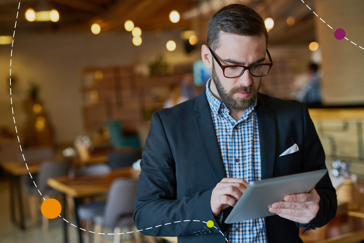 business person using tablet inside restaurant