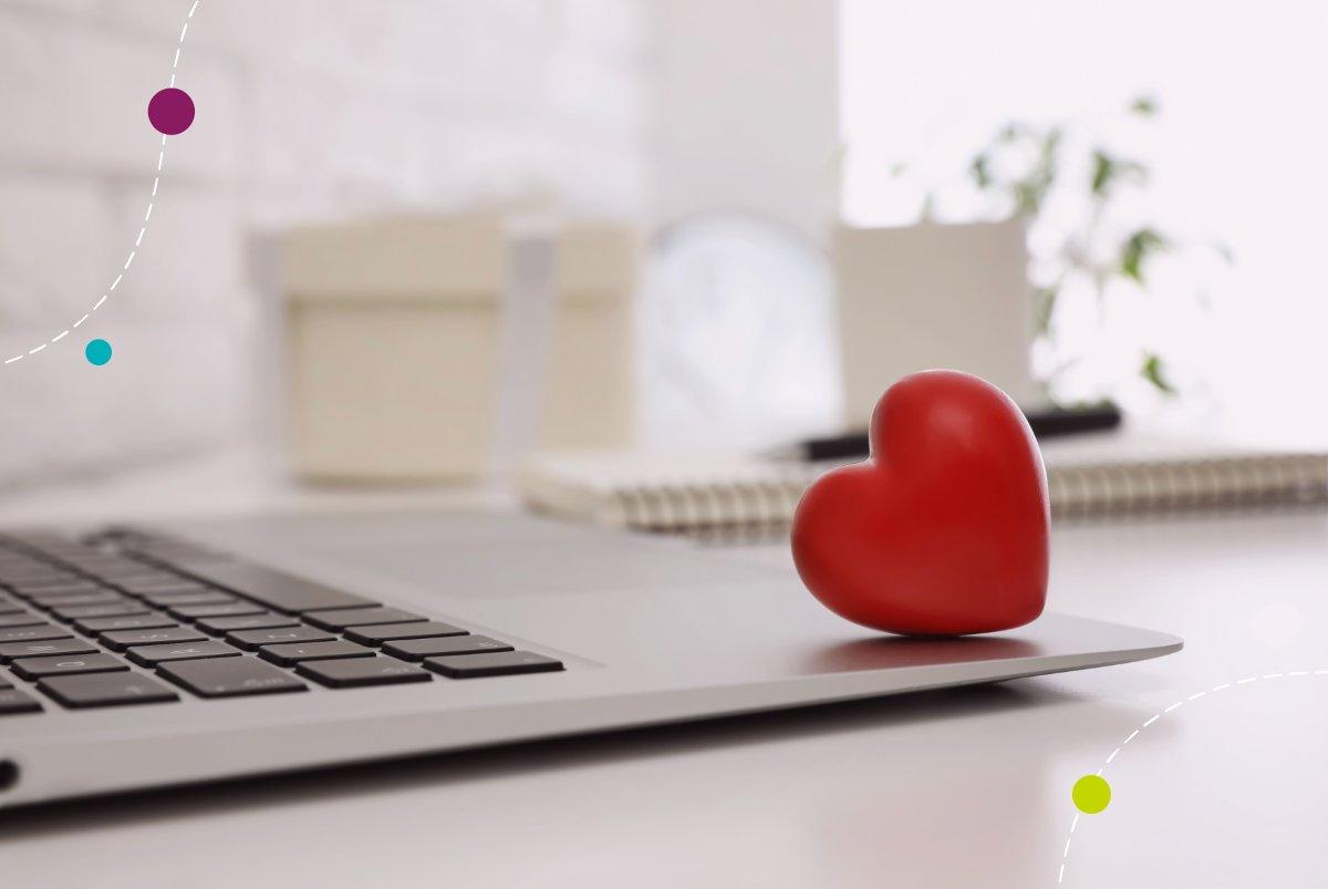 Toy heart on laptop keyboard